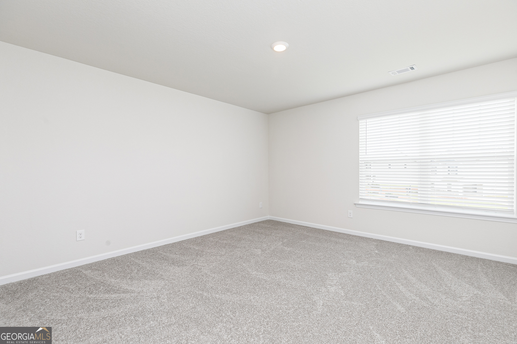 615 Slate Road Conyers, GA 30013 - Photo 21 of 21 an empty room with a window
