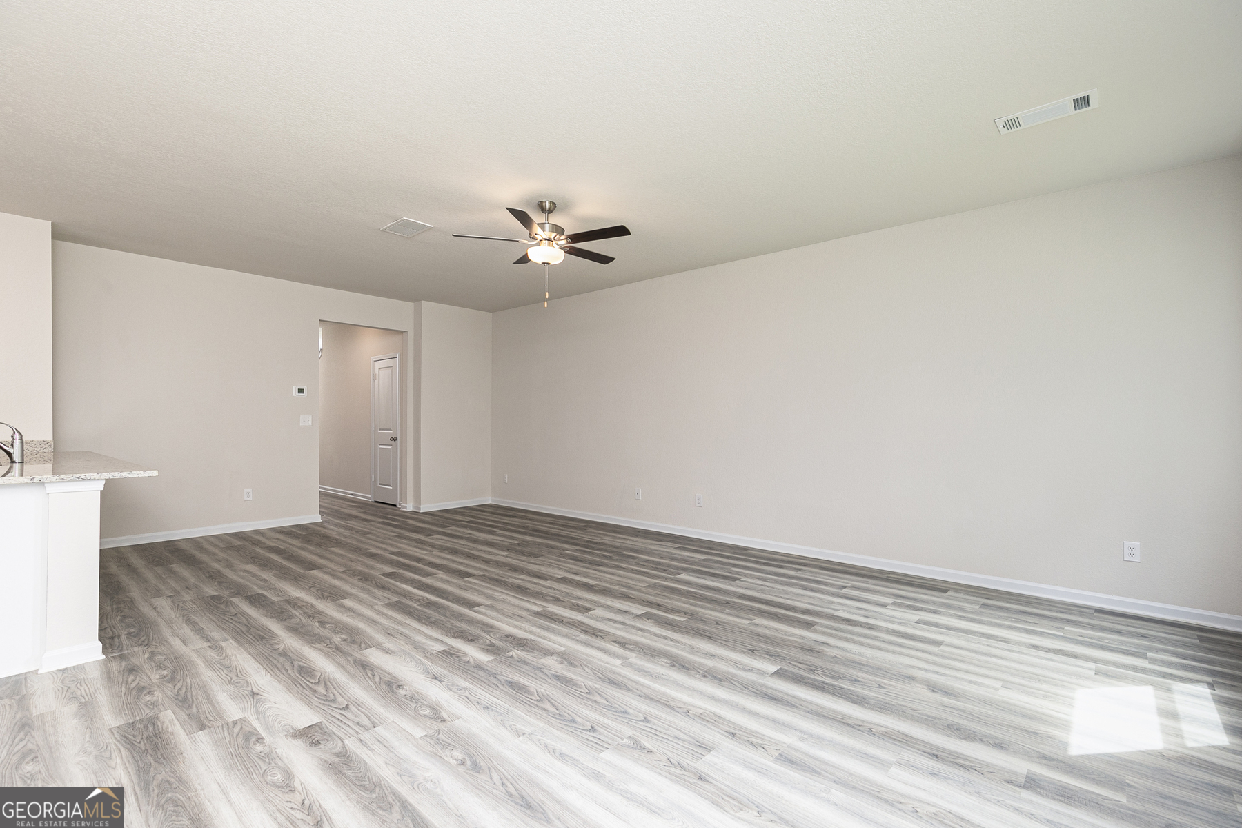 615 Slate Road Conyers, GA 30013 - Photo 5 of 21 a view of an empty room with a window