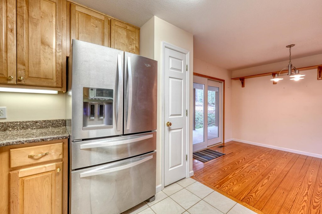 2478 High River Road Hiawassee, GA 30546 - Photo 16 of 67 a kitchen with stainless steel appliances granite countertop a refrigerator and a stove top oven