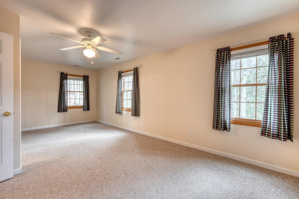 2478 High River Road Hiawassee, GA 30546 - Photo 27 of 67 an empty room with windows and ceiling fan