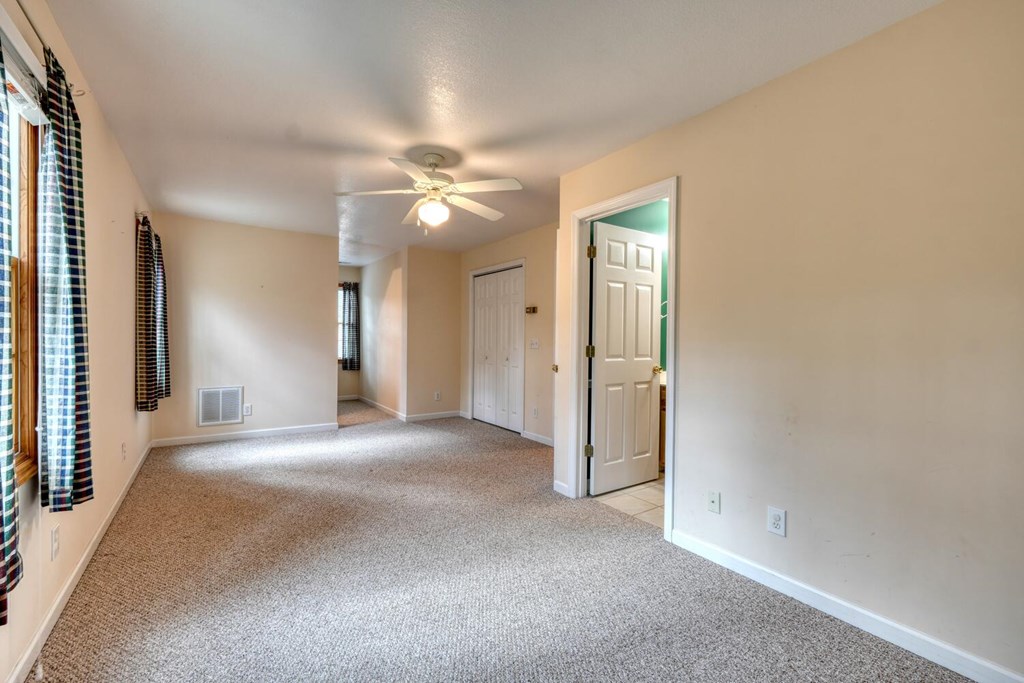 2478 High River Road Hiawassee, GA 30546 - Photo 29 of 67 a view of a hallway with a chandelier fan and windows