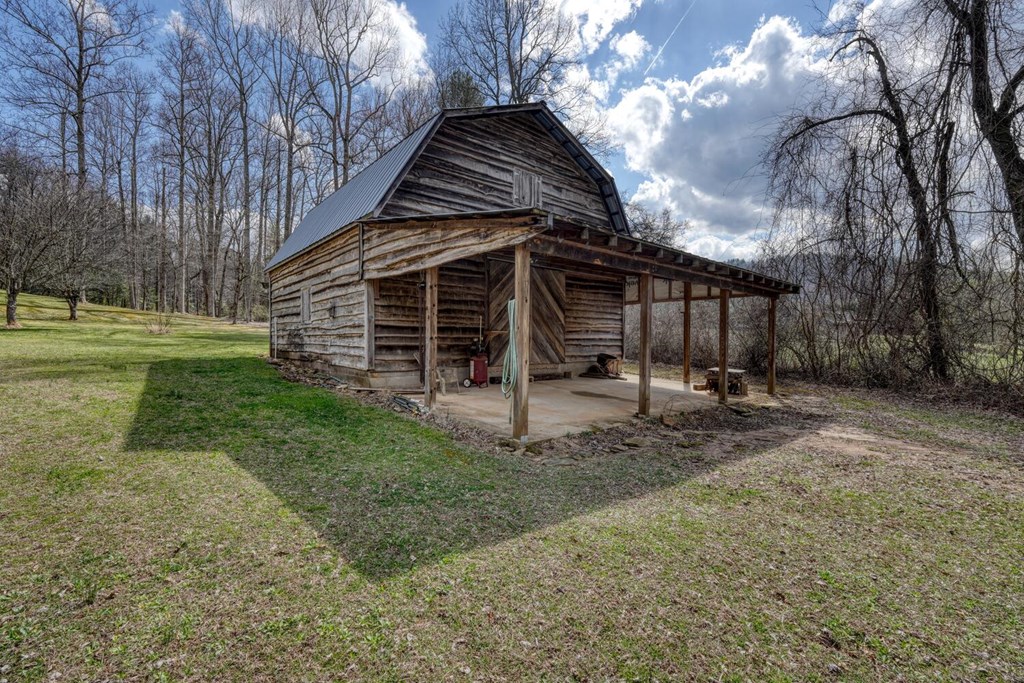 2478 High River Road Hiawassee, GA 30546 - Photo 56 of 67 a view of a house with a yard