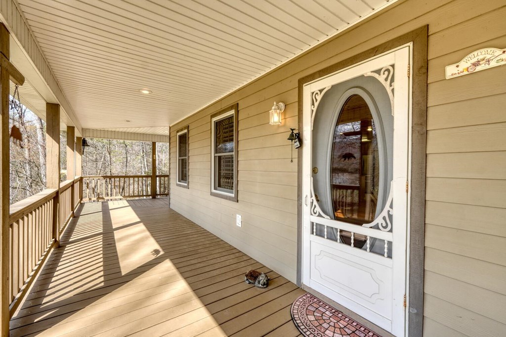 2478 High River Road Hiawassee, GA 30546 - Photo 8 of 67 a view of a hallway with wooden floor and staircase