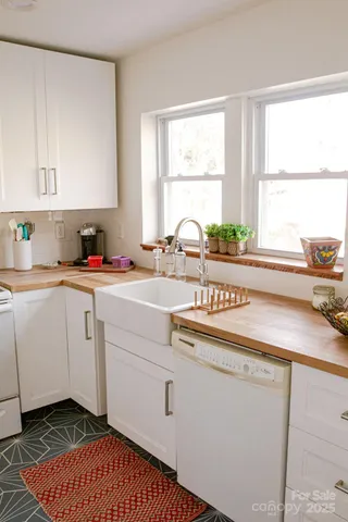 a close view of a stove top oven and cabinets