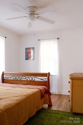 a view of a room with window and wooden floor