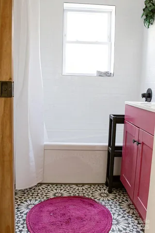 a bathroom with a sink a mirror and vanity