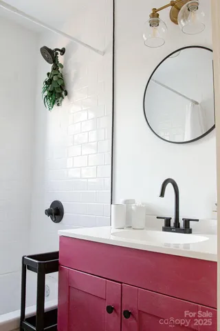 a bathroom with a sink and mirror