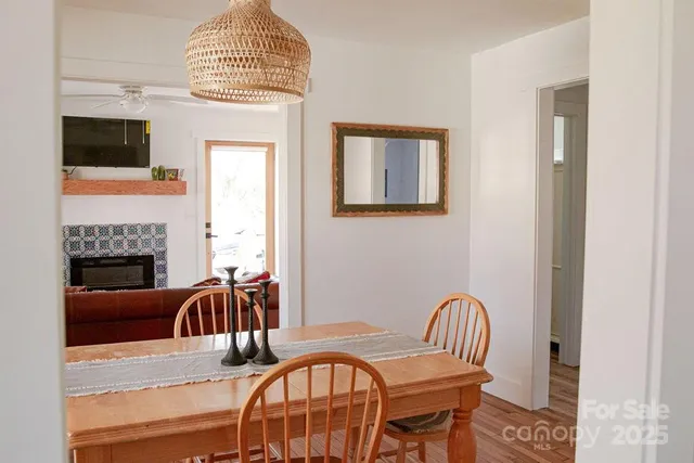 a view of a livingroom with furniture window and wooden floor