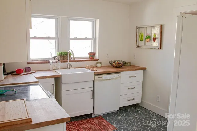 a living room with furniture a fireplace and a table