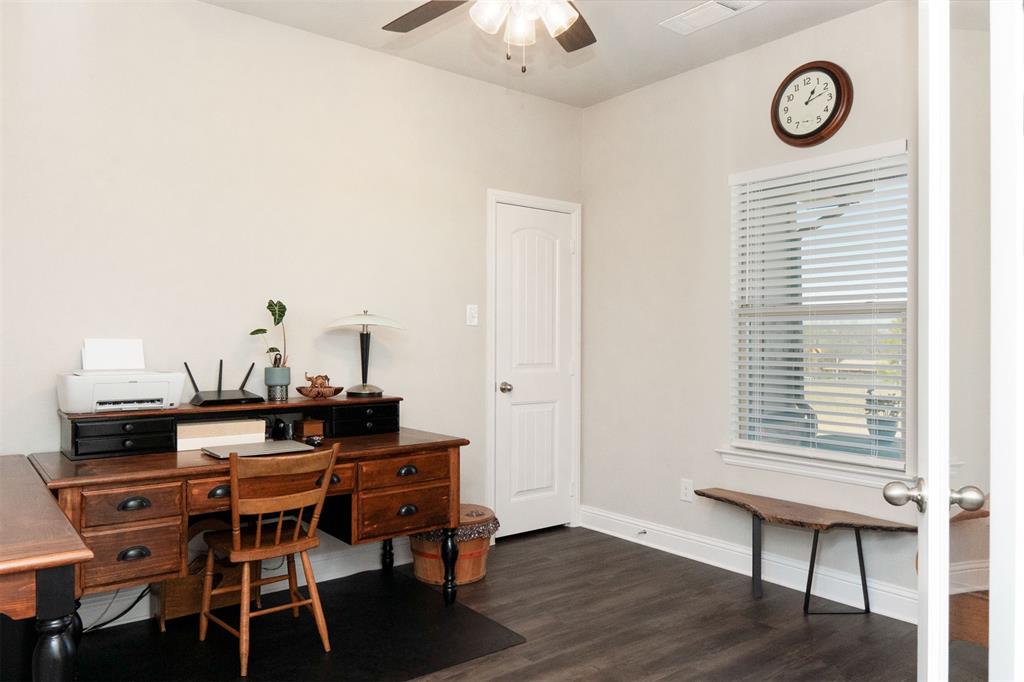 849 County Road 4764 Boyd, TX 76023 - Photo 4 of 40 a view of a workspace with furniture and wooden floor