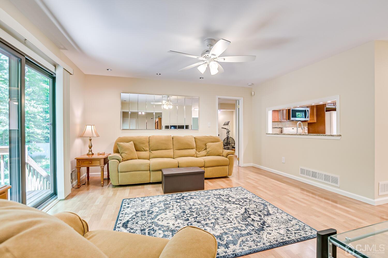 1606 Timber Oaks Road Edison, NJ 08820 - Photo 14 of 33 a living room with furniture and a large window