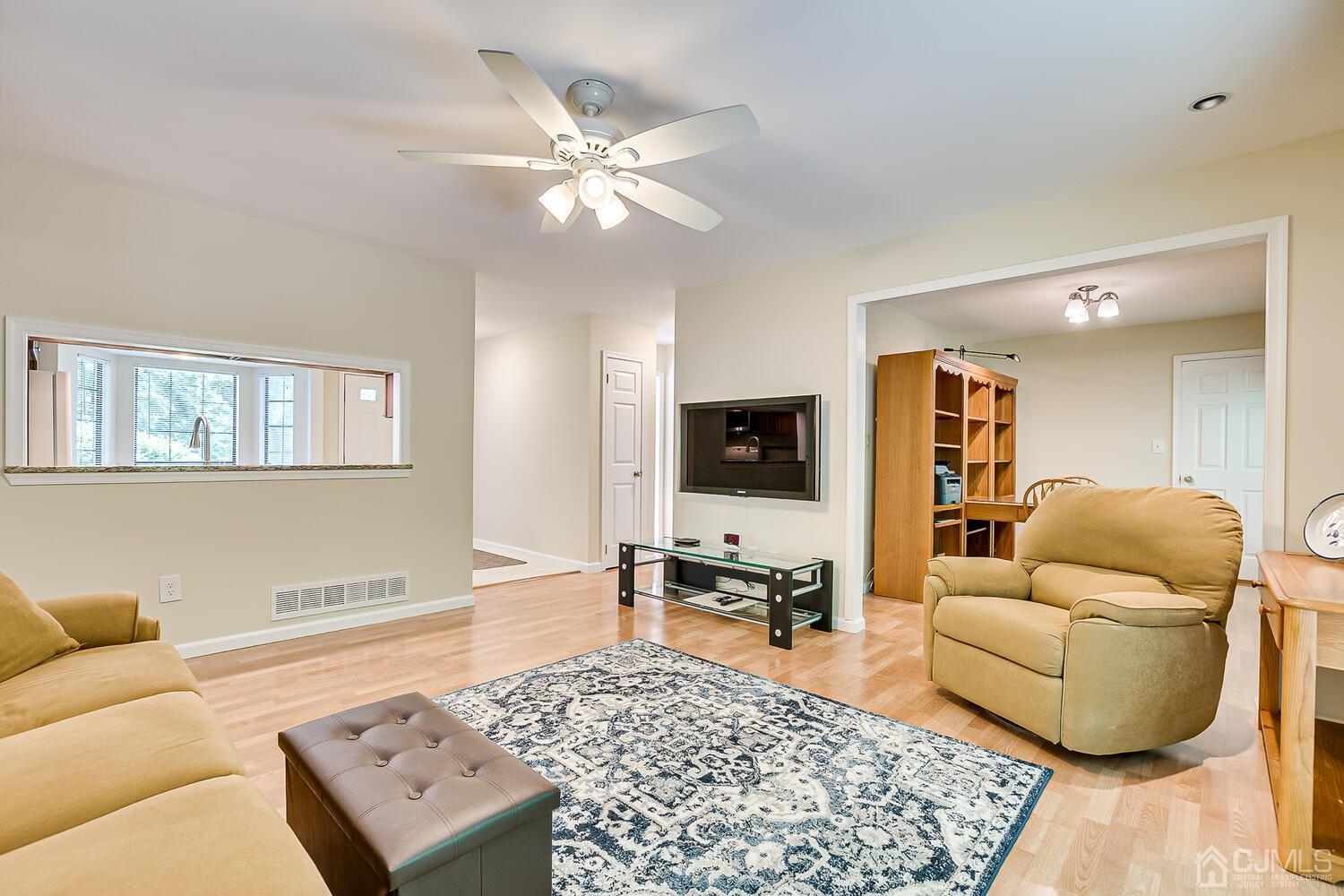 1606 Timber Oaks Road Edison, NJ 08820 - Photo 15 of 33 a living room with furniture and a flat screen tv