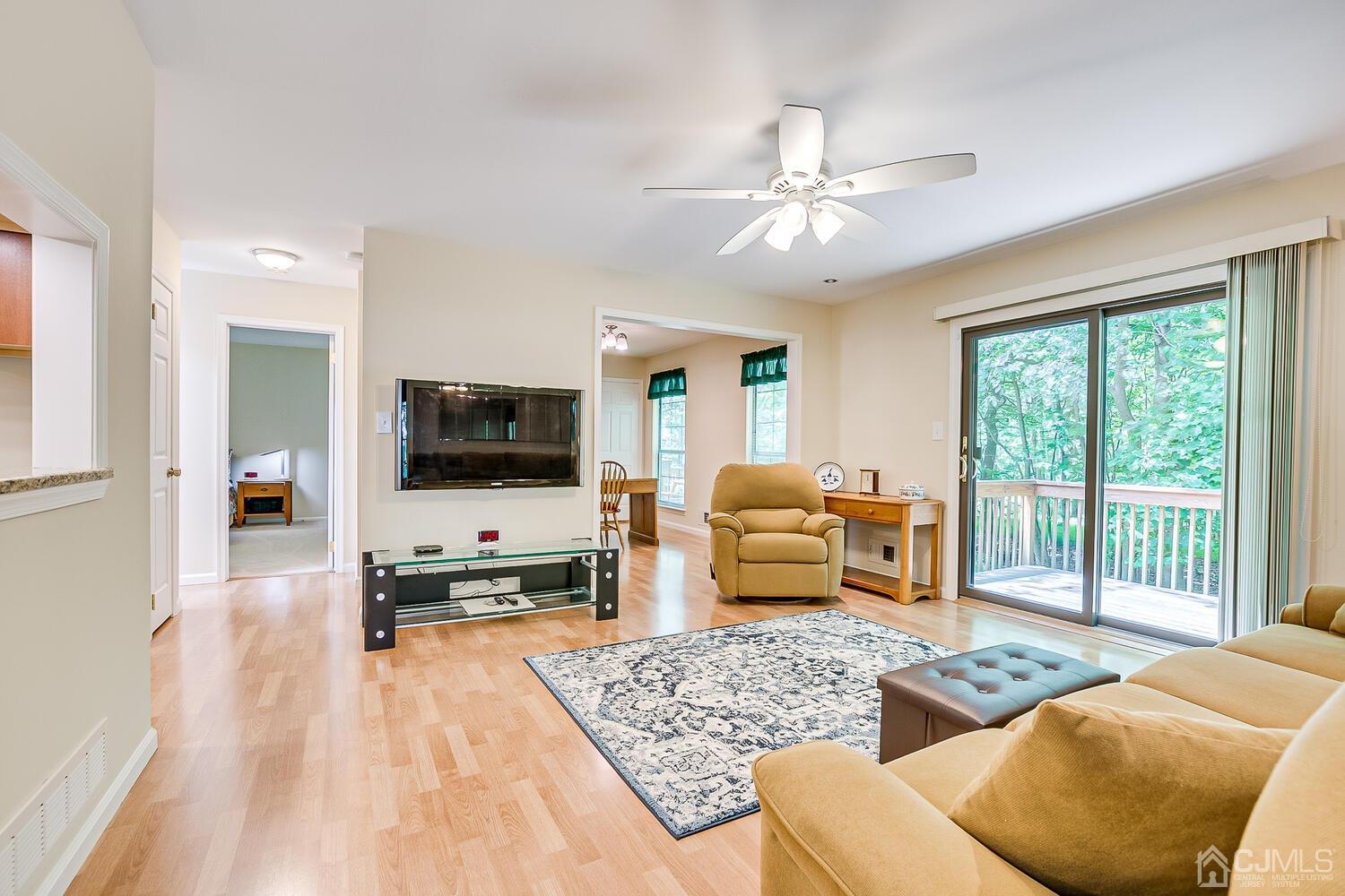 1606 Timber Oaks Road Edison, NJ 08820 - Photo 16 of 33 a living room with furniture and a flat screen tv