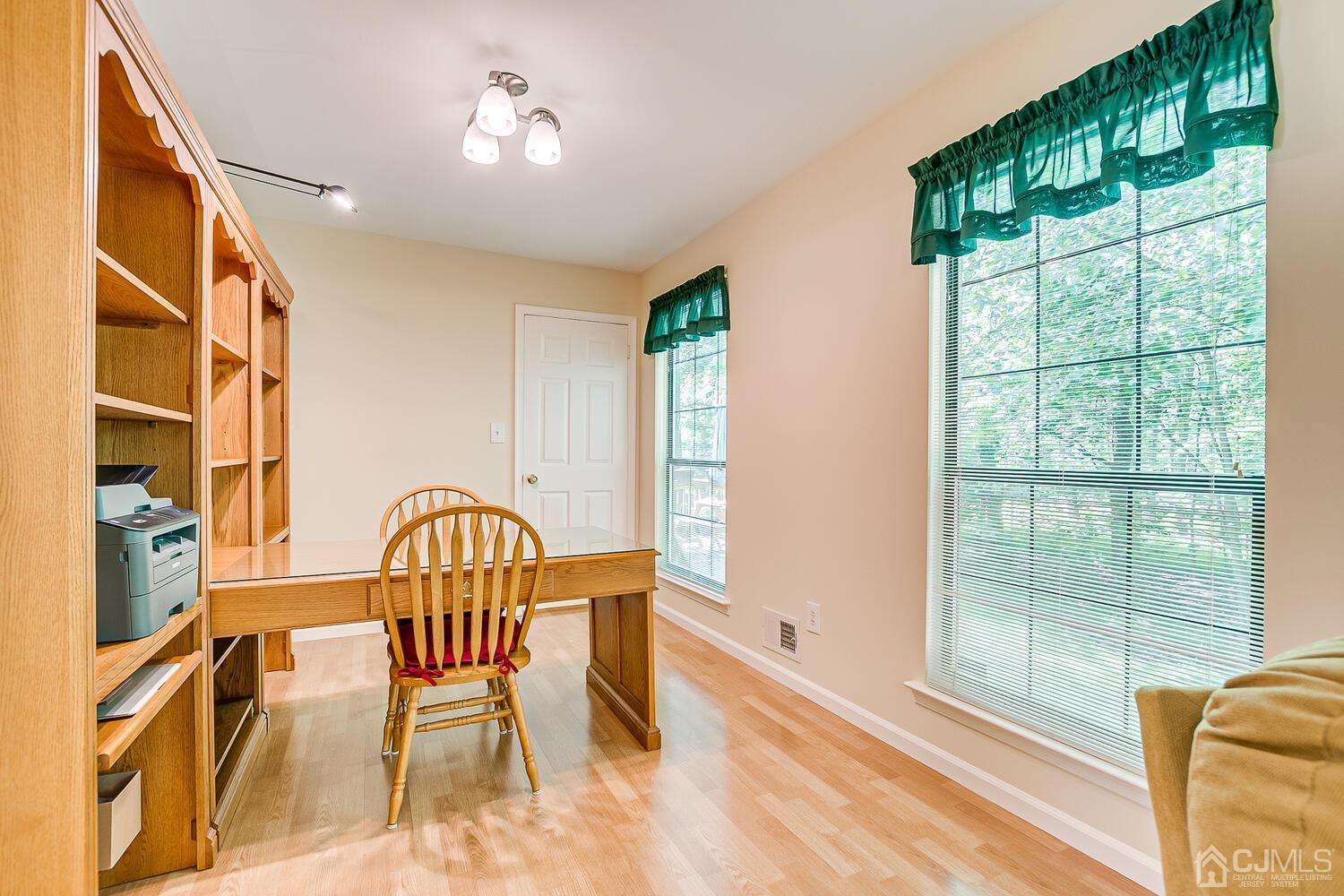 1606 Timber Oaks Road Edison, NJ 08820 - Photo 17 of 33 a view of a livingroom with furniture a floor to ceiling window and wooden floor