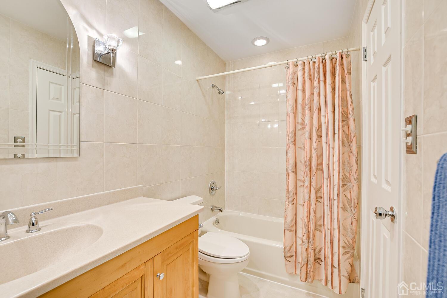 1606 Timber Oaks Road Edison, NJ 08820 - Photo 24 of 33 a bathroom with a sink a toilet and shower