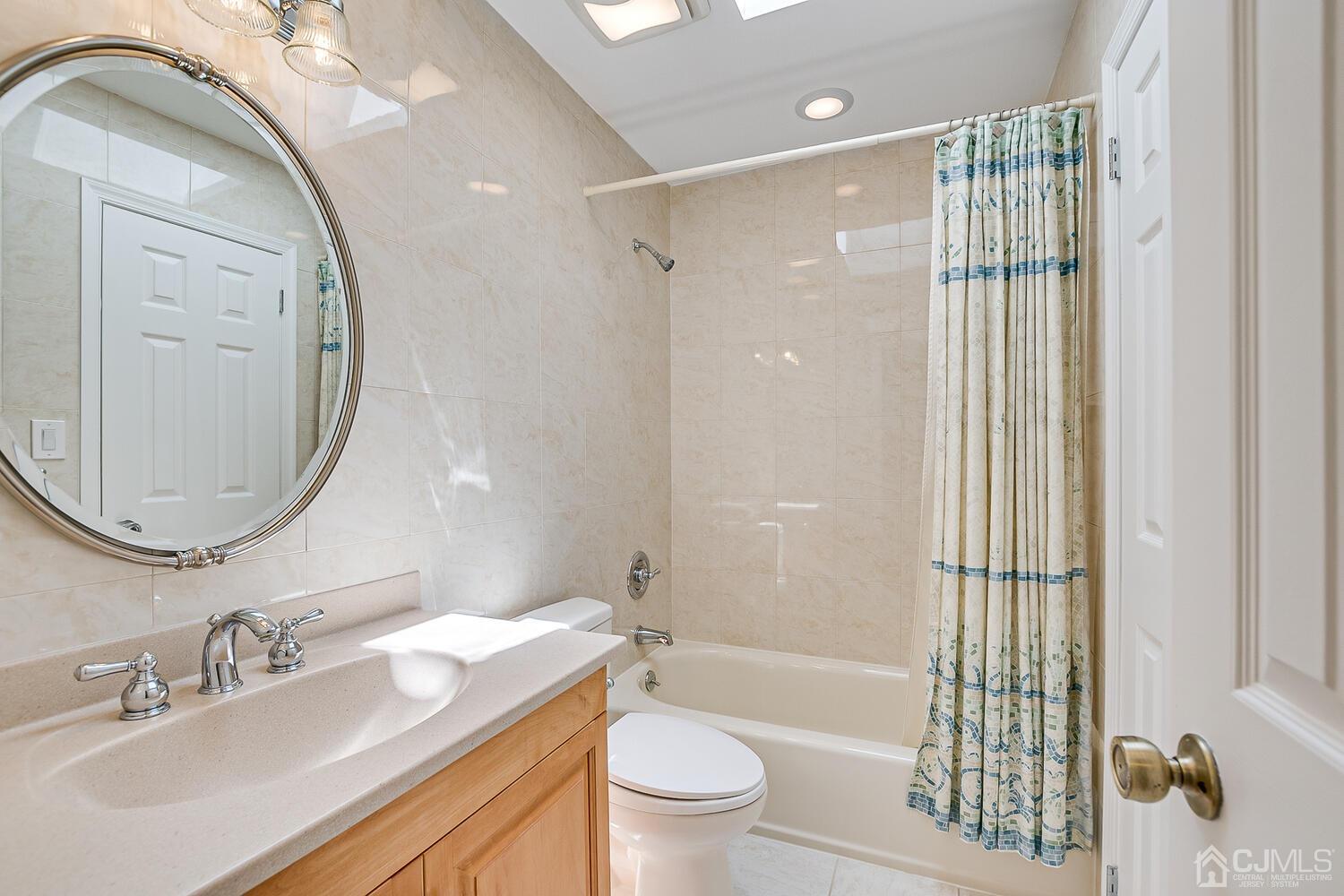 1606 Timber Oaks Road Edison, NJ 08820 - Photo 27 of 33 a bathroom with a sink a toilet and shower