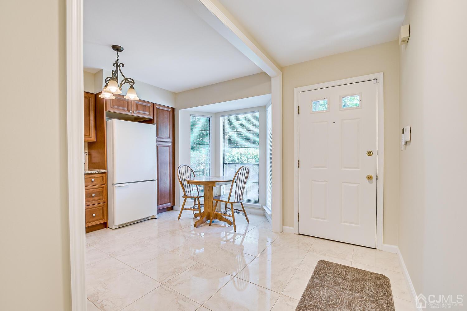 1606 Timber Oaks Road Edison, NJ 08820 - Photo 7 of 33 a dining room with furniture and a window