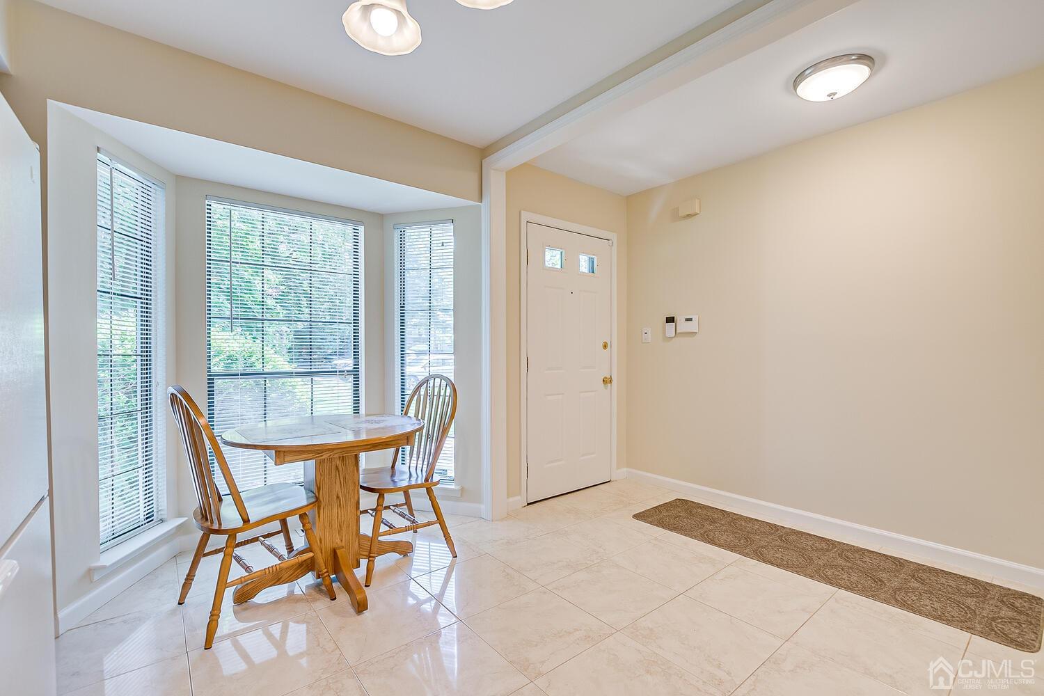 1606 Timber Oaks Road Edison, NJ 08820 - Photo 10 of 33 a dining room with furniture and a window