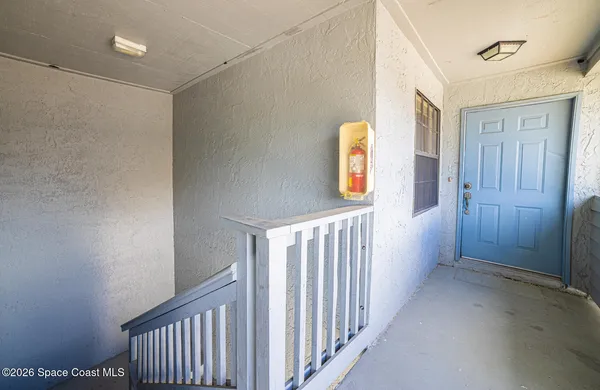 a view of a hallway with a window