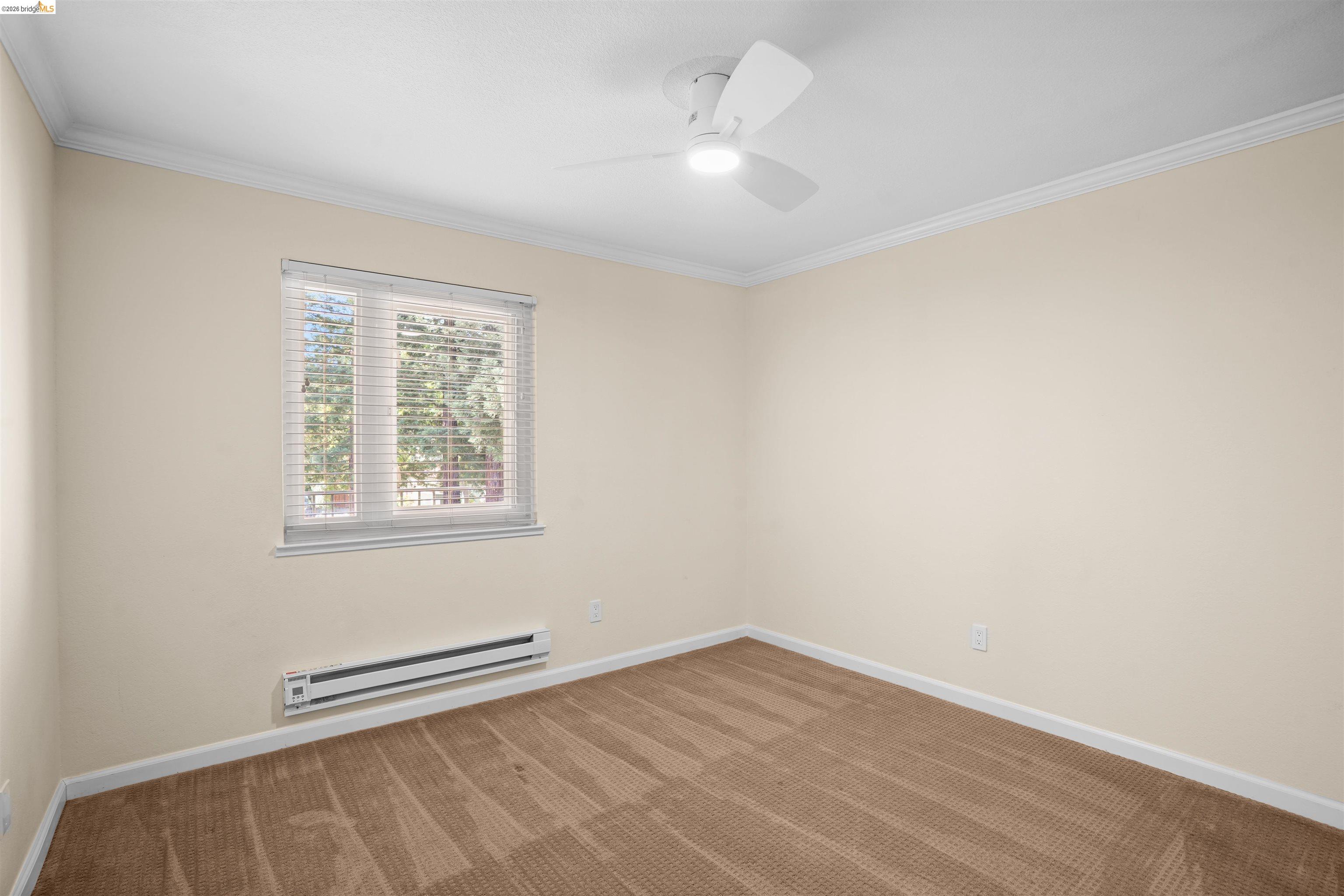1505 Kirker Pass Road, Unit 214 Concord, CA 94521 - Photo 40 of 55 Room featuring neutral wall tones, crown molding, and a ceiling fan with integrated lighting