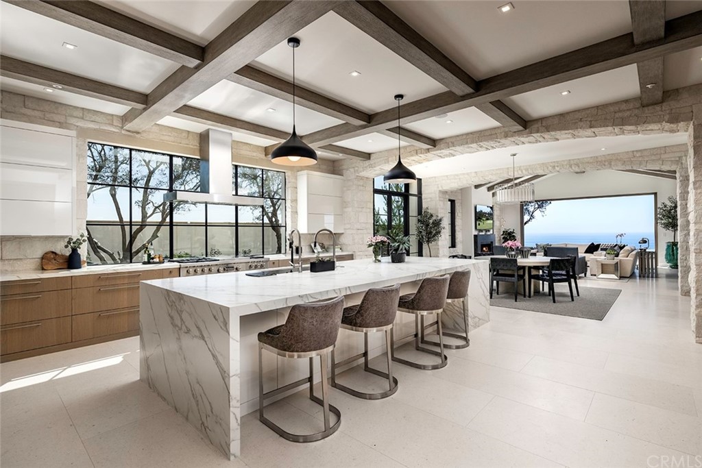 12 Swimmers Newport Coast, CA 92657 - Photo 15 of 38 a kitchen with lots of counter top space and painting on the wall