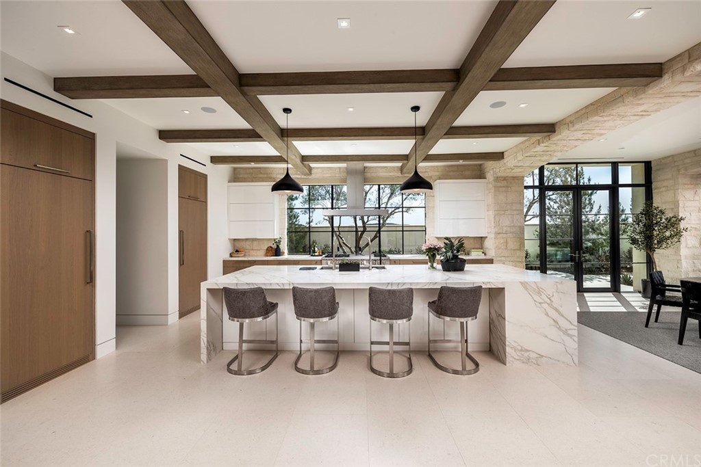 12 Swimmers Newport Coast, CA 92657 - Photo 16 of 38 a view of a dining room with furniture a chandelier and wooden floor