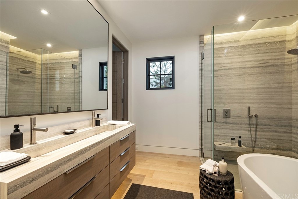 12 Swimmers Newport Coast, CA 92657 - Photo 23 of 38 a bathroom with a tub sink and mirror