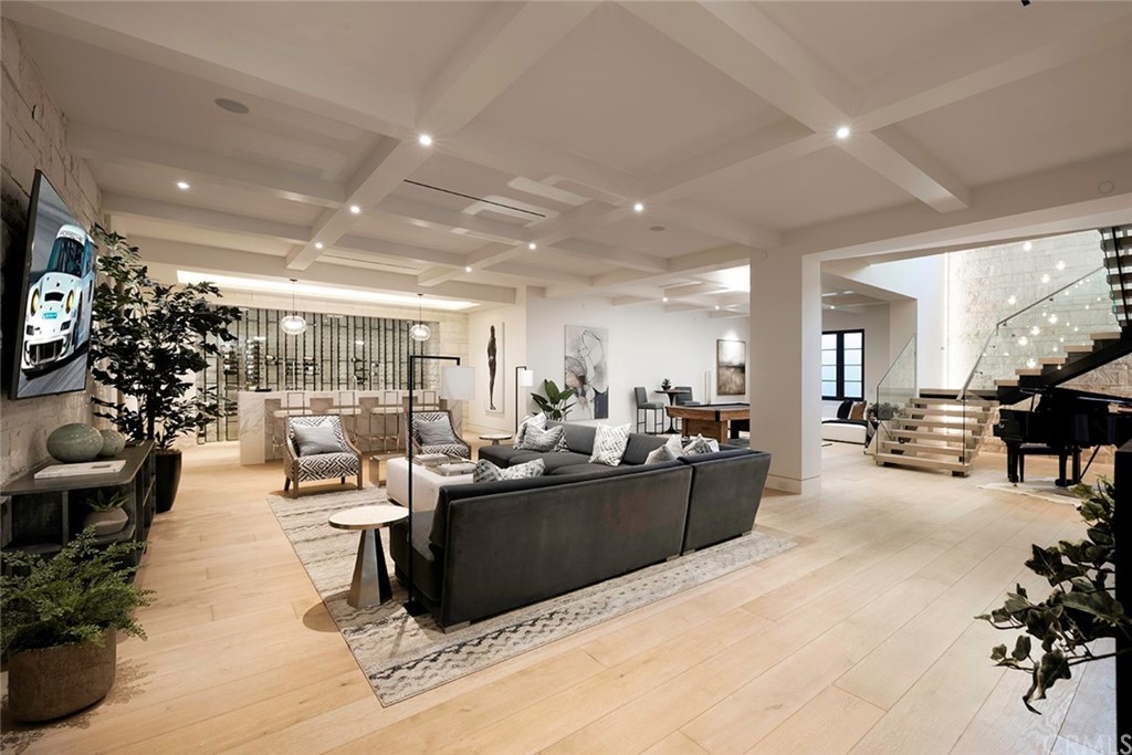 12 Swimmers Newport Coast, CA 92657 - Photo 25 of 38 a living room with furniture potted plant and kitchen view