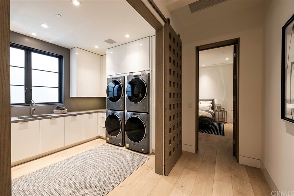 12 Swimmers Newport Coast, CA 92657 - Photo 28 of 38 a view of a hallway with washer and dryer
