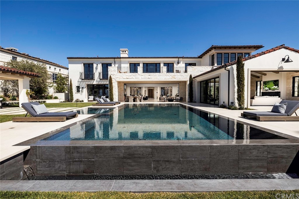 12 Swimmers Newport Coast, CA 92657 - Photo 10 of 38 a view of a house with swimming pool