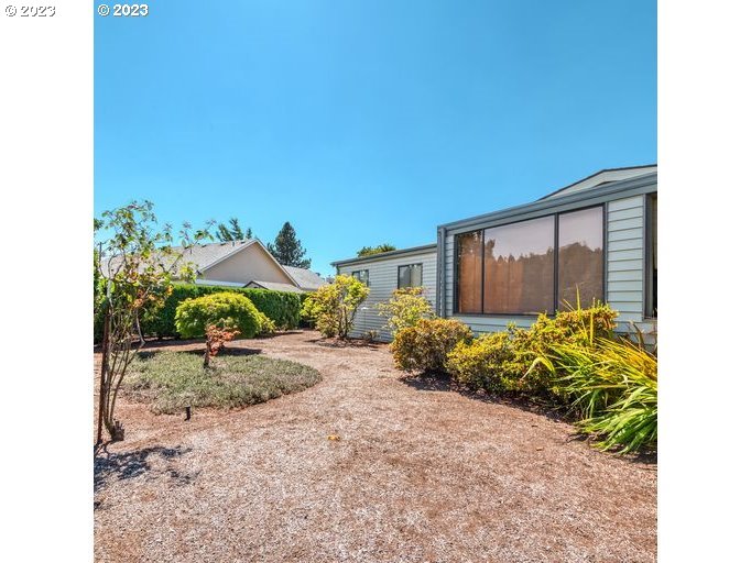 1199 North Terry Street Eugene, OR 97402 - Photo 23 of 32 a view of a backyard with potted plants
