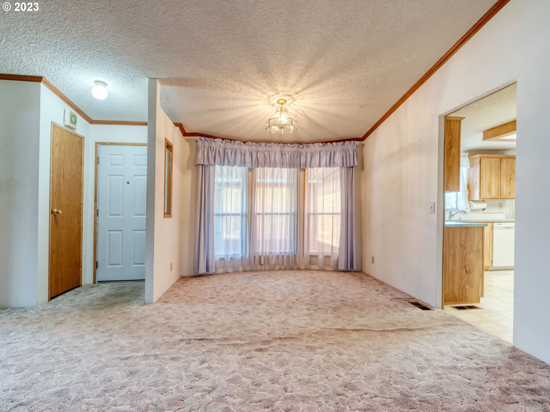 1199 North Terry Street Eugene, OR 97402 - Photo 7 of 32 a view of an empty room with a window