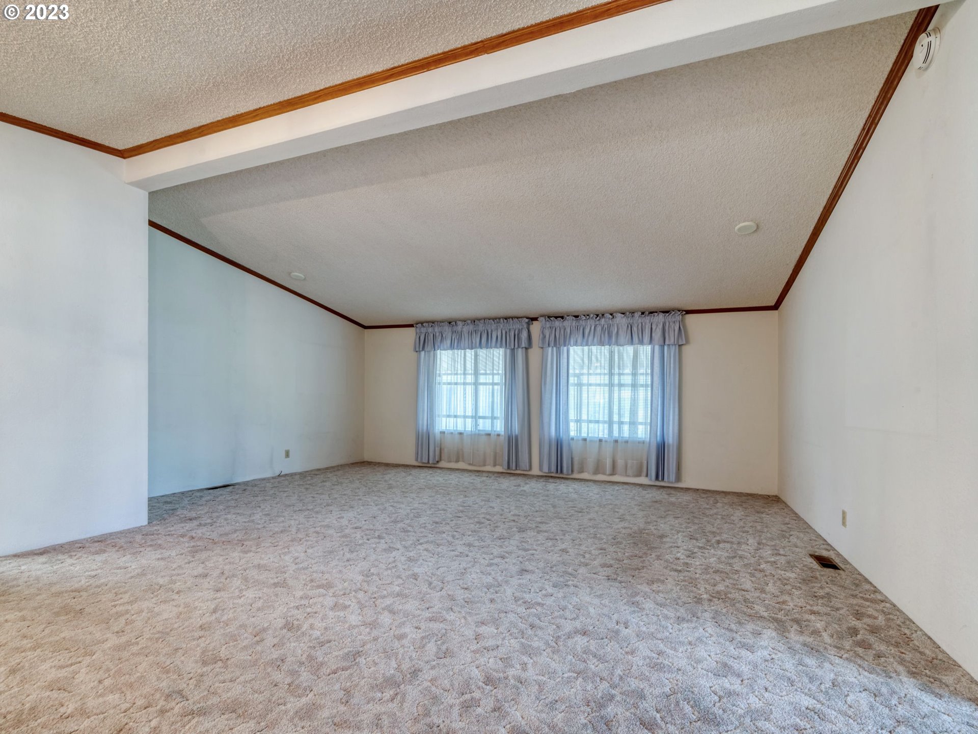 1199 North Terry Street Eugene, OR 97402 - Photo 8 of 32 a view of an empty room with a window