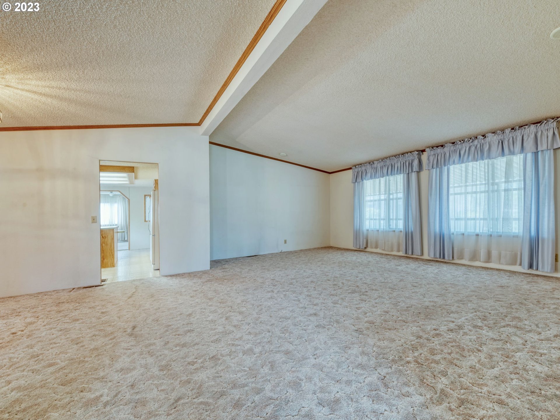 1199 North Terry Street Eugene, OR 97402 - Photo 9 of 32 a view of an empty room with window and wooden floor