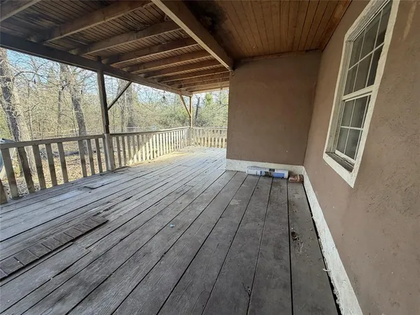 a view of balcony with wooden floor
