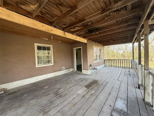 a view of backyard with wooden deck