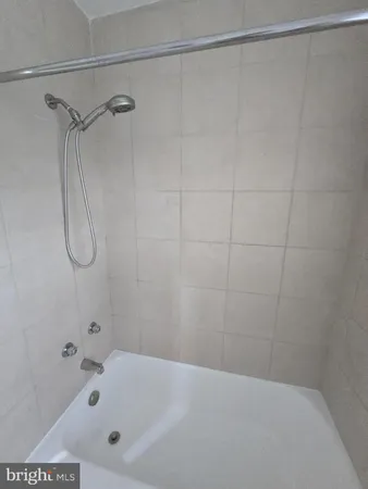 a bathroom with a bath tub and a shower