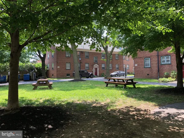 a view of a house with backyard patio and swimming pool
