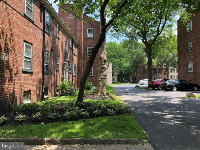 a view of street with parked cars