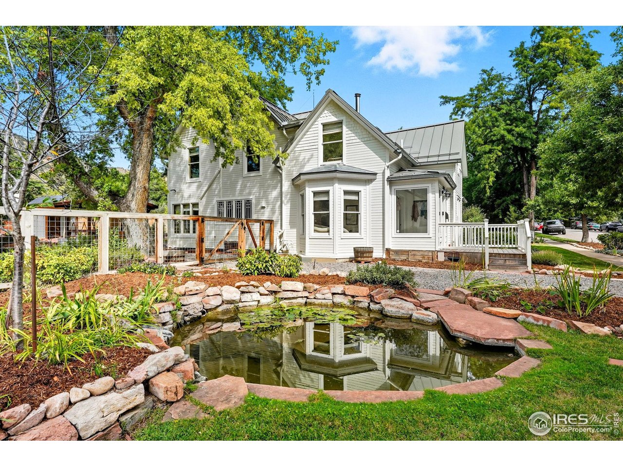 3119 9th Street Boulder, CO 80304 - Photo 2 of 12 front view of house with a yard
