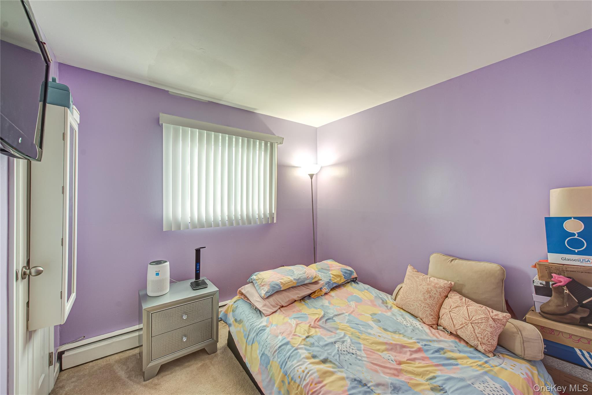 15 Major Road Massapequa, NY 11758 - Photo 14 of 25 a bedroom with a bed and a window