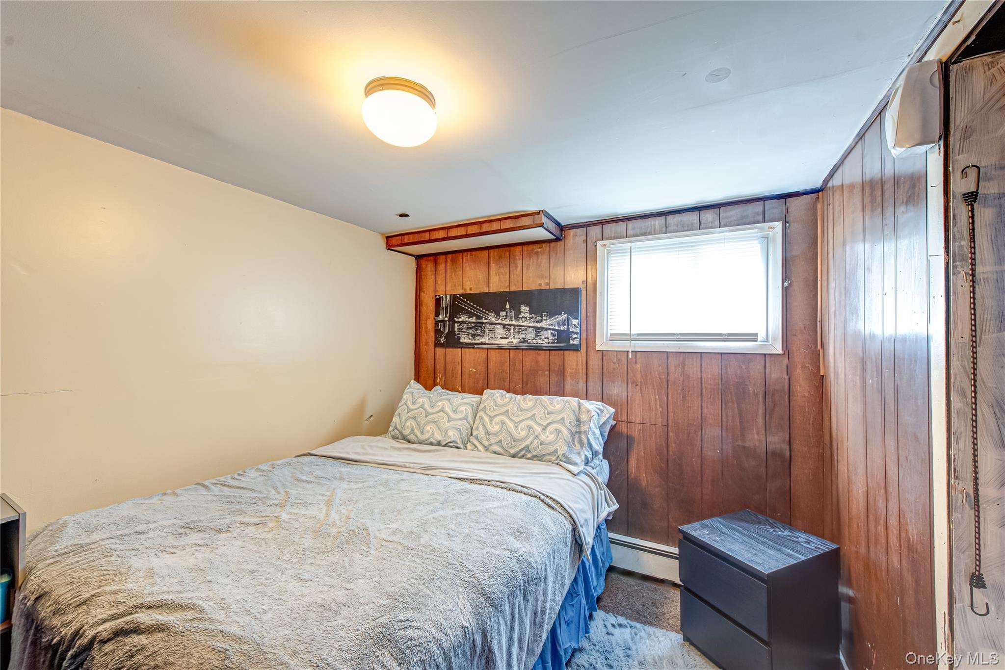 15 Major Road Massapequa, NY 11758 - Photo 20 of 25 a bedroom with a bed and a window