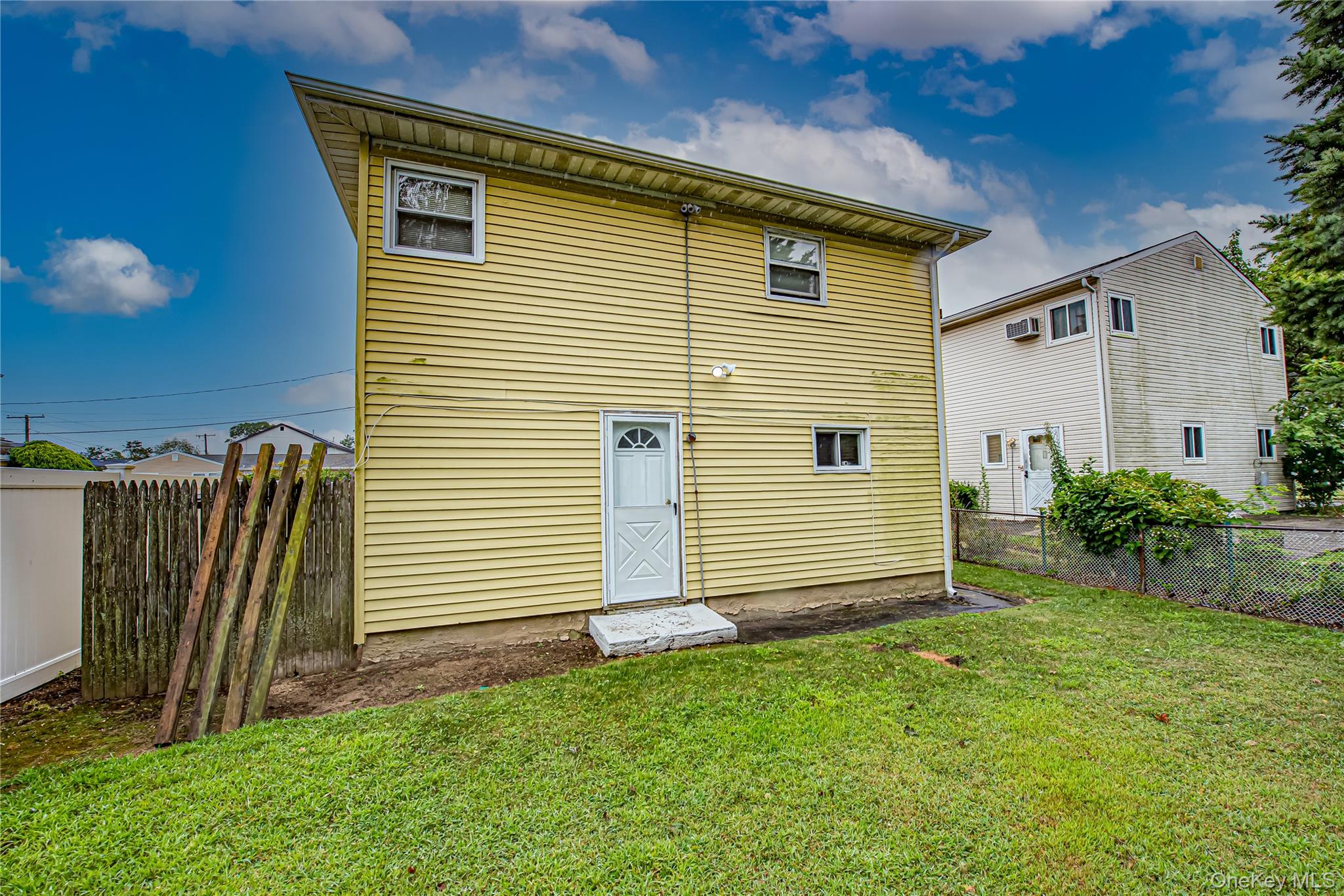 15 Major Road Massapequa, NY 11758 - Photo 21 of 25 a front view of a house with a yard