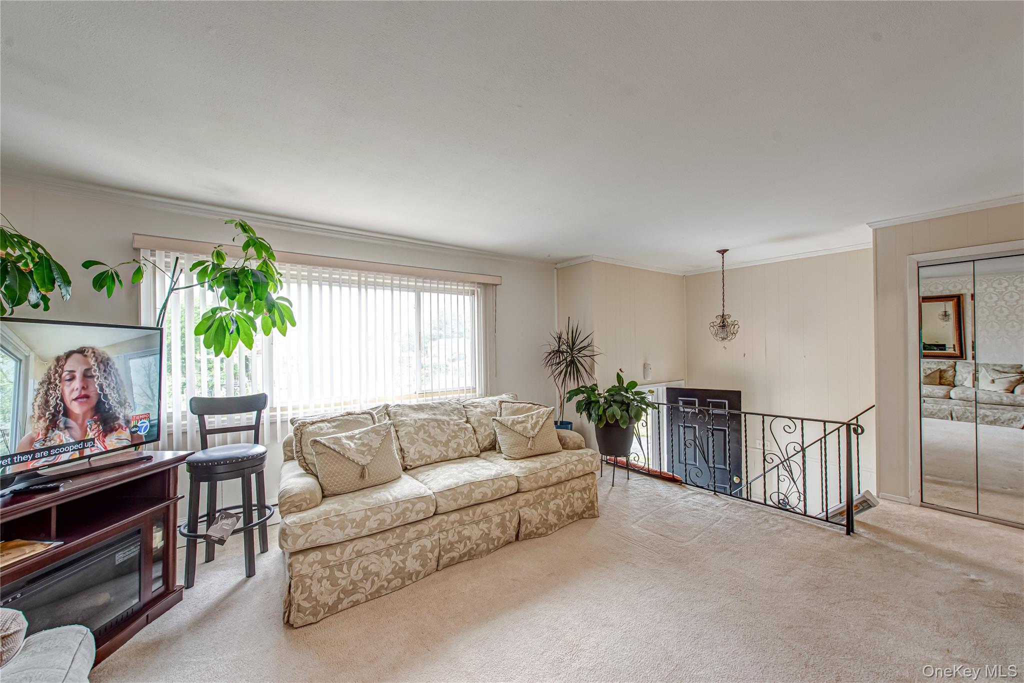 15 Major Road Massapequa, NY 11758 - Photo 5 of 25 a living room with furniture and a flat screen tv