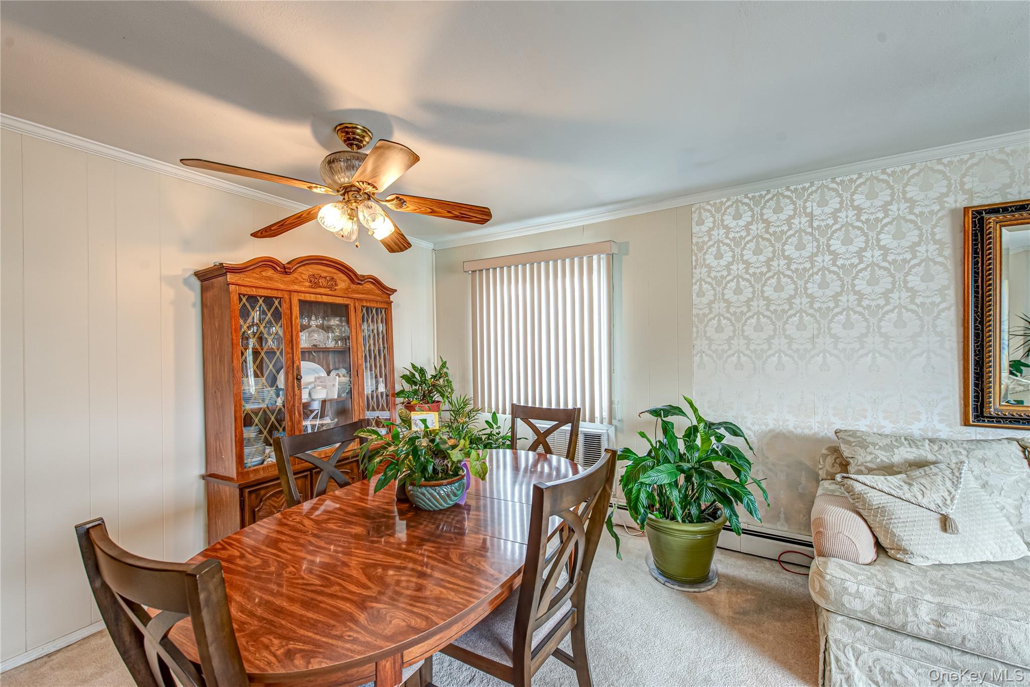 15 Major Road Massapequa, NY 11758 - Photo 7 of 25 a dining room filled with furniture and a potted plant