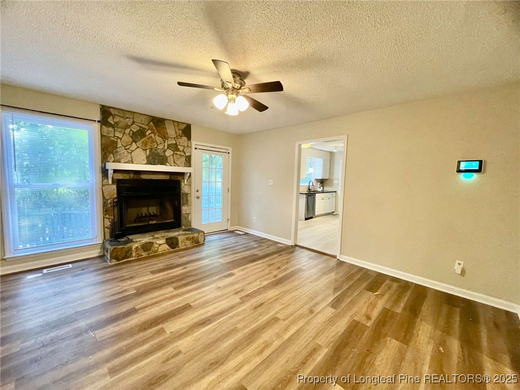 1505 Diamond Road Fayetteville, NC 28311 - Photo 15 of 21 a view of an empty room with a fireplace and a window