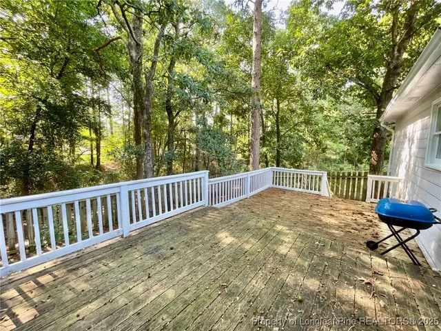 a view of balcony with wooden floor