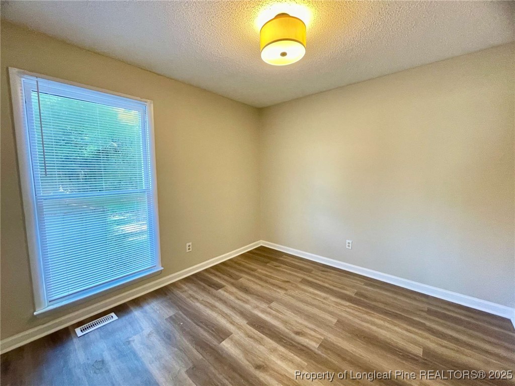 1505 Diamond Road Fayetteville, NC 28311 - Photo 8 of 21 an empty room with windows