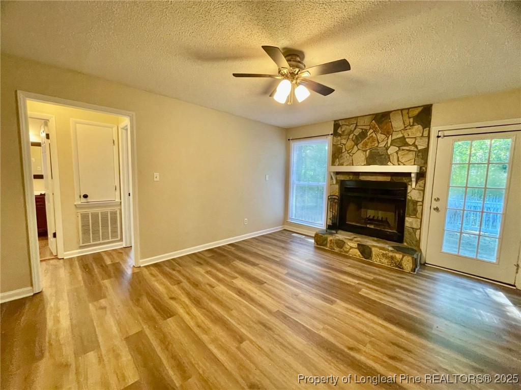 1505 Diamond Road Fayetteville, NC 28311 - Photo 9 of 21 a view of empty room with wooden floor and fan