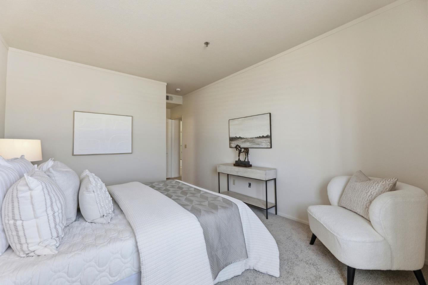 22330 Homestead Road, Unit 226 Cupertino, CA 95014 - Photo 23 of 38 a bedroom with a bed and a couch